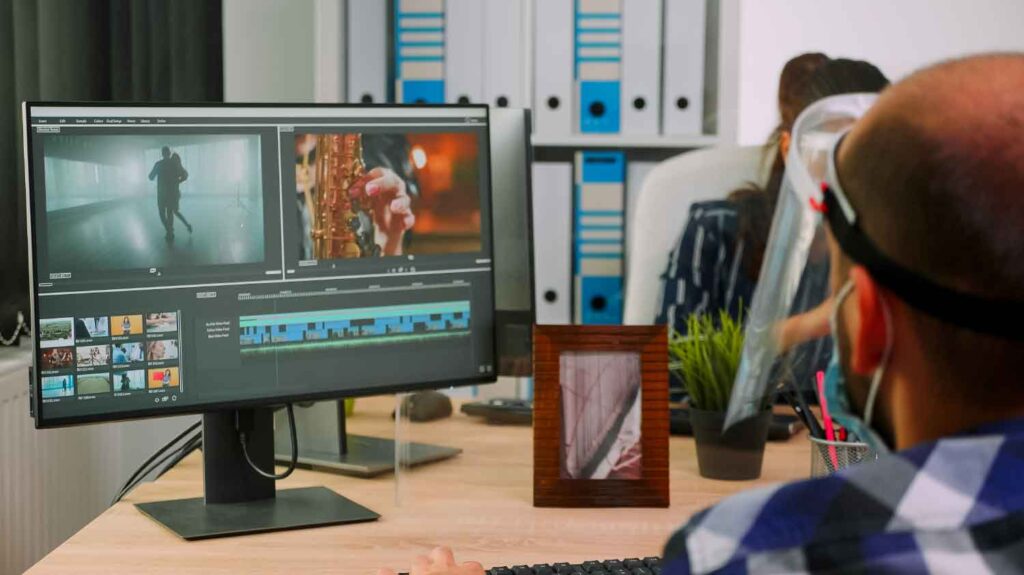 man editing video template on after effects