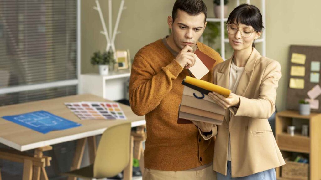 man and woman thinking and choosing a color for interior design