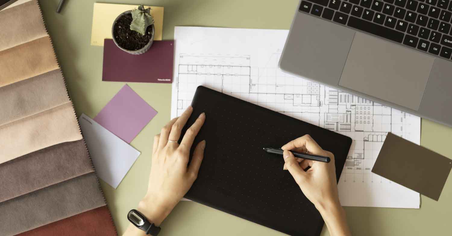 designing with electronic pencil on laptop
